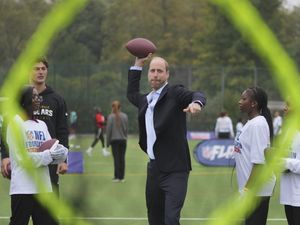 Supporting image for story: William shows off ‘unbelievable arm’ playing American football with youngsters