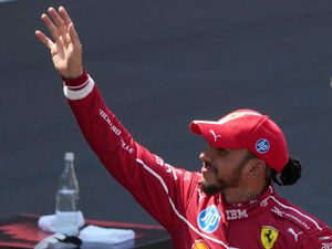 Lewis Hamilton celebrates winning in China
