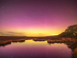 The aurora on the Long Mynd reflected in the bog pool  on the Long Mynd photo Andrew Fusek Peters