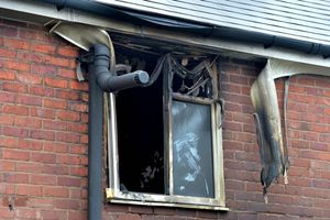 Fire damage in a first-floor window. Witnesses said the fire consumed the whole house