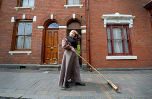 Lee Adams sweeps the pavements as she prepares for reopening