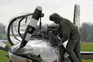 A pilot gets out of the Tucano after a display at the base