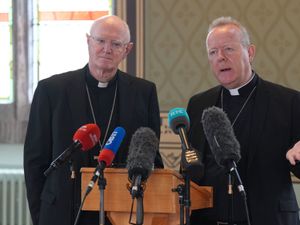 Archbishop of Armagh Eamon Martin, watched by Archbishop Dermot Farrell of Dublin, speaks at a press conference following the death of Pope Francis