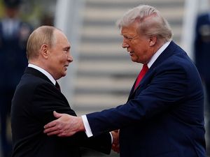 Supporting image for story: Donald Trump and Vladimir Putin shake hands in Alaska as Ukraine war talks begin