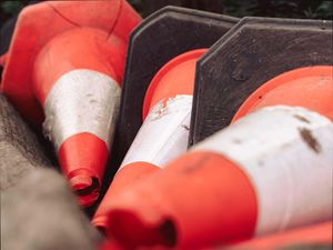 Traffic cones piled together on their sides