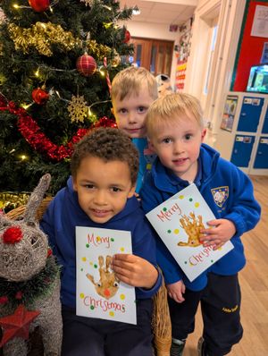 Showing off their creative card skills 3-year-olds Corey, Oscar and 2-year-old Dexter.