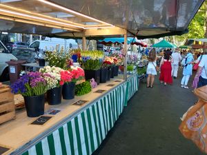 A colourful street market beside the River Seine