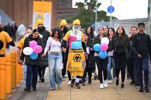 Manny begins his final lap flanked by family and friends