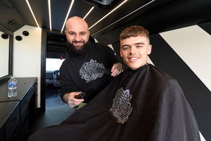 Alex Colucci of Colucci's Chopshop took his mobile salon to Priory Park School, Dudley, to give pupils a free haircut. Pupil Callum Portman, aged 15, enjoys having a trim