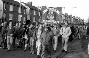 Miners marching away from Littleton Colliery, after the last shift in December 1993. Malc Armishaw can be seen third in from the left, with Jimmy Perry standing to the right of the Piper, and Alan Owen
standing next to him. Malc Wakeman is in the foreground, with Nemit Hulla on the far right of the second row.