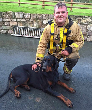 Charlie, relieved after his ordeal, sitting with Daniel Williams