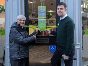 Supporting image for story: Survivor Reg attends opening of new shop supporting defibrillator charity in Market Drayton
