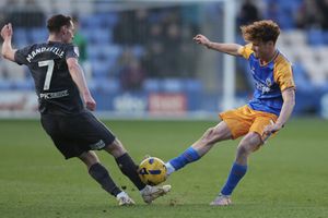 Tommy McDermott of Shrewsbury Town and Liam Mandeville of Chesterfield