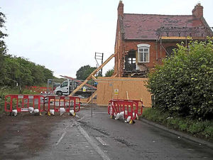 Supporting image for story: Shropshire A41 lorry crash: Work goes on to make house safe as road to stay closed for the weekend