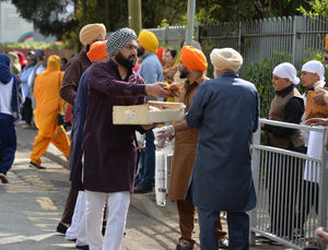The Vaisakhi parade taking place in Wolverhampton, starting from the Guru Nanak Sikh Gurdwara