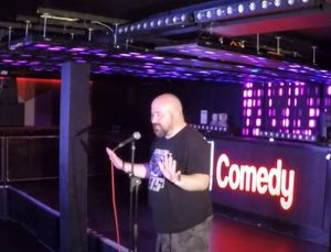 James on stage. Credit: Ultra Comedy/YouTube.