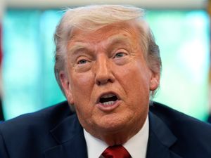 President Donald Trump speaks with reporters after signing executive orders in the Oval Office of the White House, Wednesday, April 23, 2025, in Washington