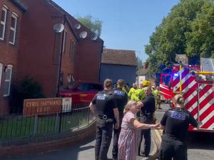 Supporting image for story: Car crashes into Telford home - emergency services on scene