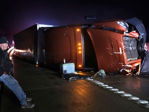 An overturned tractor in a storm