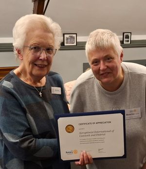Soroptimist Cresta Garner receiving the certificate from Rotary Books4Home's Beverley Ricketts