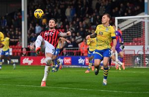 Walsall defender Aden Flint will have a tough task on his hands against Bromley striker Michael Cheek.
