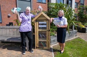 Christine (Taylor Wimpey) and Maria (Telford Hall Care Home) photographed following the outdoor library donation from Taylor Wimpey North Midlands. 
