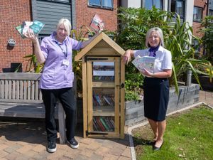 Supporting image for story: Taylor Wimpey gifts outdoor library to Telford Hall Care Home encouraging a love of reading