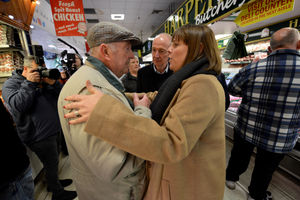 Labour leadership candidate Jess Phillips chats with shopper Alan Doughty.