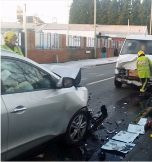 Firefighters work at the scene of yesterday's crash