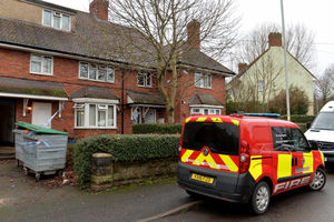 Fire investigators at the scene in Dickens Road