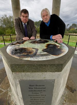 Councillor Graham Eardley and Ray Nock view the fire damage at Barr Beacon War Memorial.