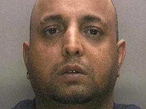 Supporting image for story: Thug who regularly beat up girlfriend had gun and bullets hidden under bed