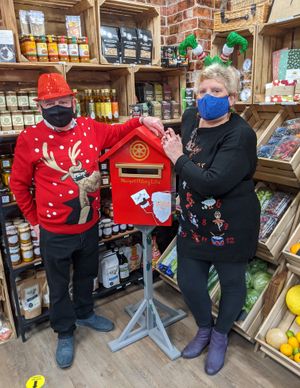 Newport Rotary Lite elves Claire and Dave Roscoe with Santa's postbox in the Box of Goodness