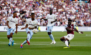 West Ham United's Mohammed Kudus (right) shoots over the bar 
