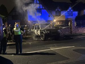Supporting image for story: Police investigating in street on outskirts of Wolverhampton after residents report hearing 'loud bangs' and Land Rover fire