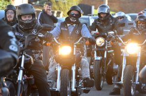 Members of the Outlaw MCs biker group arrive to deliver hats for Winnie