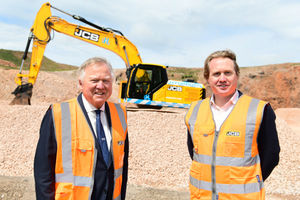Lord Bamford and his son Jo pictured with a prototype JCB 220X excavator powered by a hydrogen fuel cell