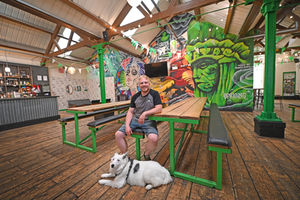 Alex Hill with Luna inside the taproom