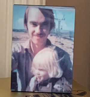 Kenny with Sarah, aged four, at Butlins