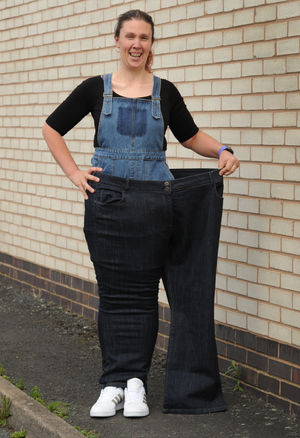 Sarah with a pair of her old jeans