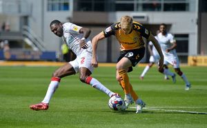 Walsall's Hayden White up against Newport County's Will Evans