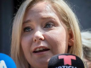 Virginia Giuffre speaks during a news conference