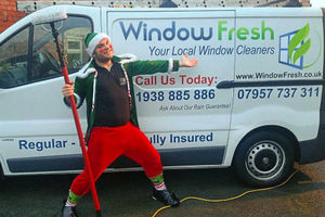 Supporting image for story: Elf and safety not an issue for festive window cleaner