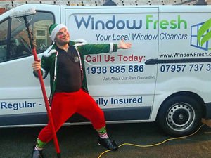 Supporting image for story: Elf and safety not an issue for festive window cleaner