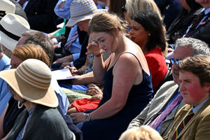 A guest reflects during the national Service of Remembrance, hosted by the Royal British Legion in partnership with the Government, to mark the 80th Anniversary of VJ Day at the National Memorial Arboretum in Alrewas, Staffordshire. Picture date: Friday August 15, 2025. PA Photo. Photo credit should read: Anthony Devlin/PA Wire 