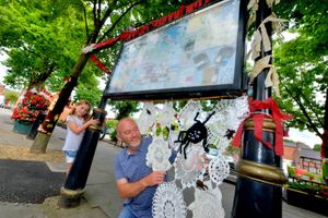 Lowri and Ian Anderson admire the yarn bombing