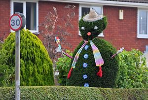 A resident creates a fun greeting to the village