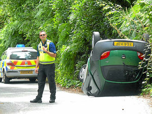 Supporting image for story: Woman rescued as car crashes down embankment