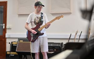 Andy playing the guitar