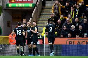 Romain Saiss is mobbed after his goal (AMA)